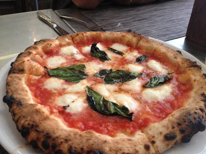 A margarita pizza with fresh mozzarella and local basil.