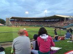 I love to sit on the grassy field by the outfield at McCoy Stadium.