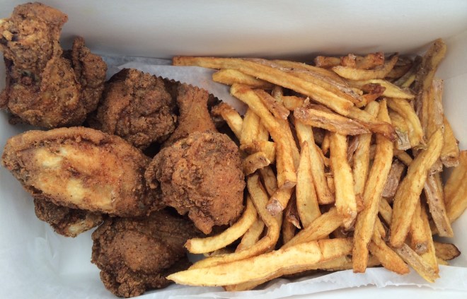 Fried chicken wings and french fries at Soulfull in Providence.
